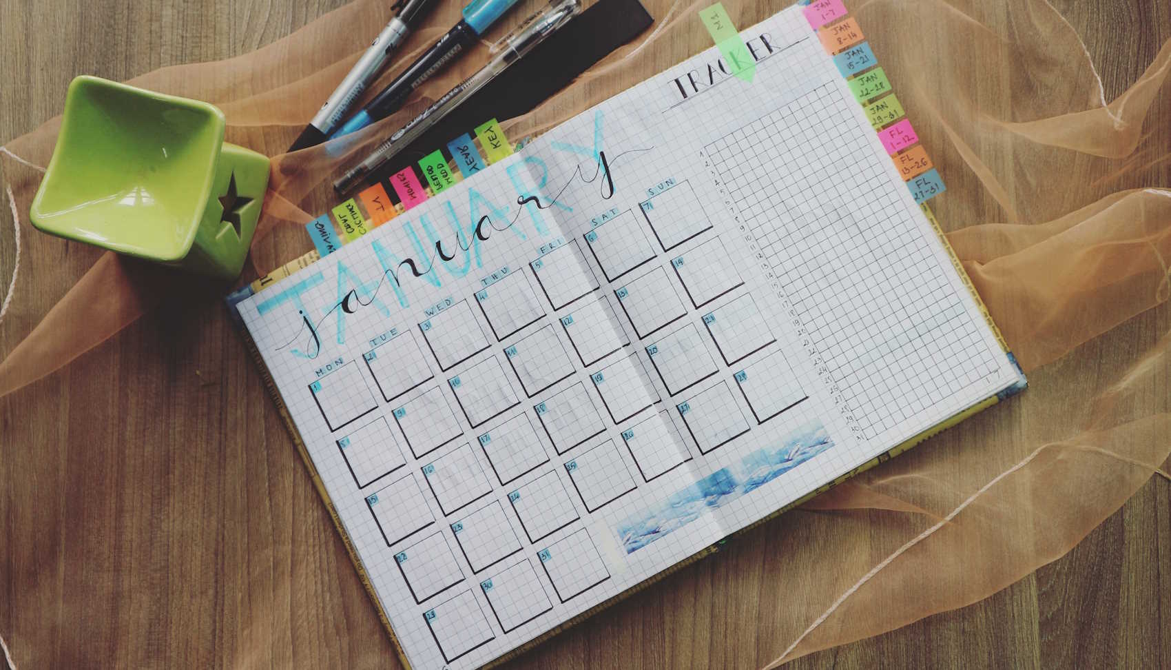Picture of planner opened up to a monthly calendar.
